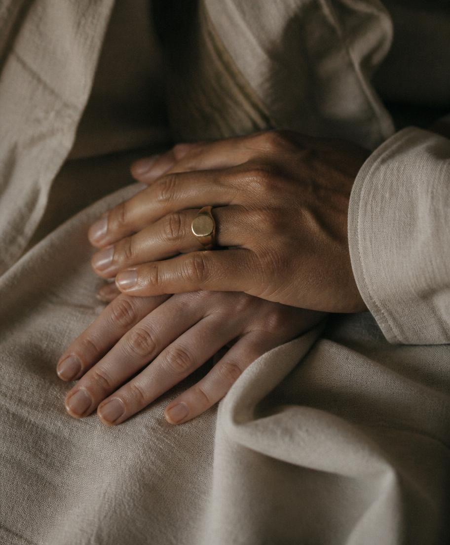 Two hands resting together, representing gender-affirming care at VSculpt